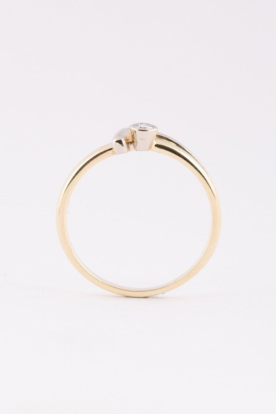 wit/geel gouden ring met een briljant