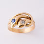 Gouden slangenring met saffier en diamant