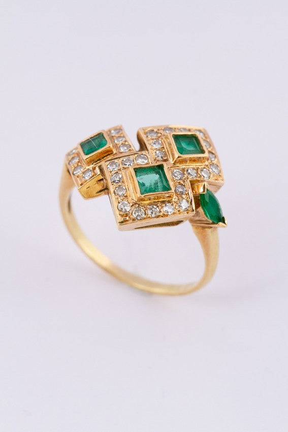 Gold ring with diamonds and emeralds
