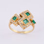 Gold ring with diamonds and emeralds