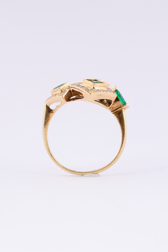 Gold ring with diamonds and emeralds