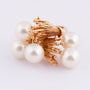 Golden artistic ring with cultured pearls