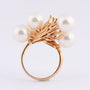 Golden artistic ring with cultured pearls