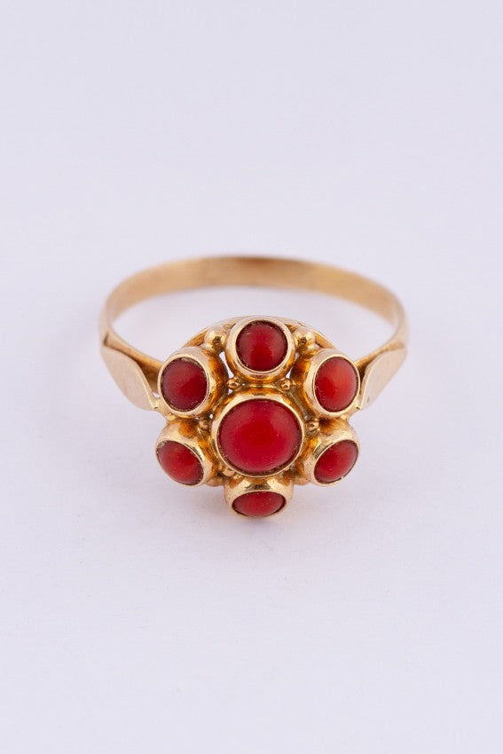 Gold entourage ring with blood corals