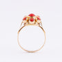 Gold entourage ring with blood corals