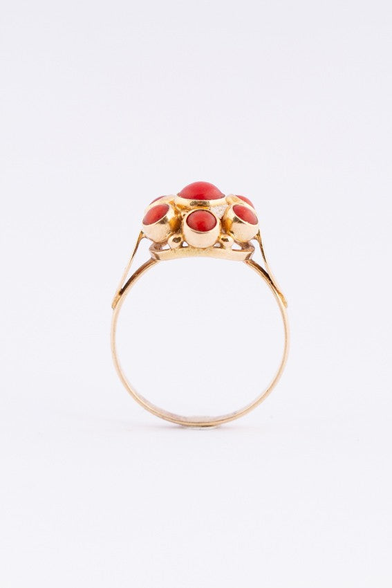 Gold entourage ring with blood corals
