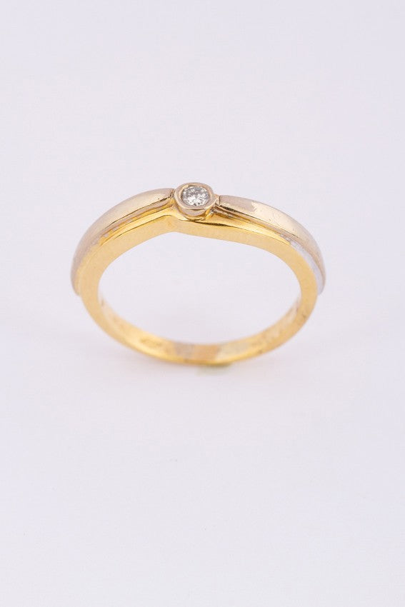 White/yellow gold ring with a brilliant