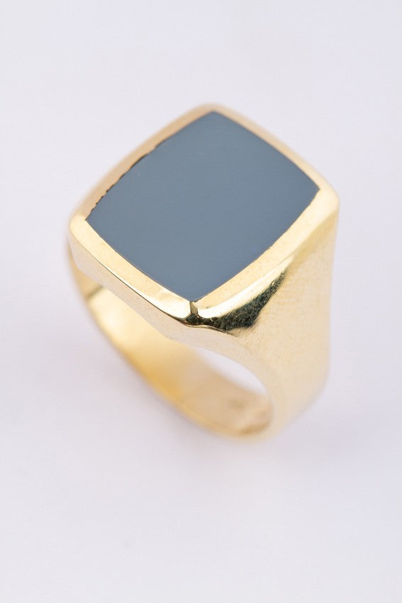 Gold men's ring with a blue layered stone