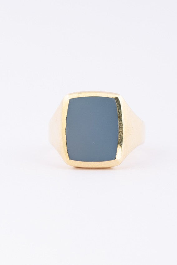 Gold men's ring with a blue layered stone