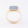Gold men's ring with a blue layered stone