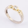 White/yellow gold row ring with 3 brilliant-cut diamonds