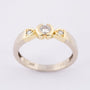 White/yellow gold row ring with 3 brilliant-cut diamonds