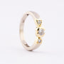 White/yellow gold row ring with 3 brilliant-cut diamonds