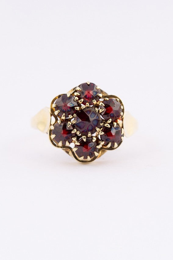 Gouden entourage ring met granaten