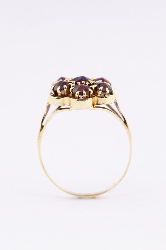 Gouden entourage ring met granaten