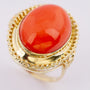 Gold ring with large cabochon cut blood coral