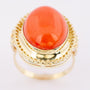 Gold ring with large cabochon cut blood coral
