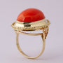 Gold ring with large cabochon cut blood coral