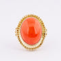 Gold ring with large cabochon cut blood coral