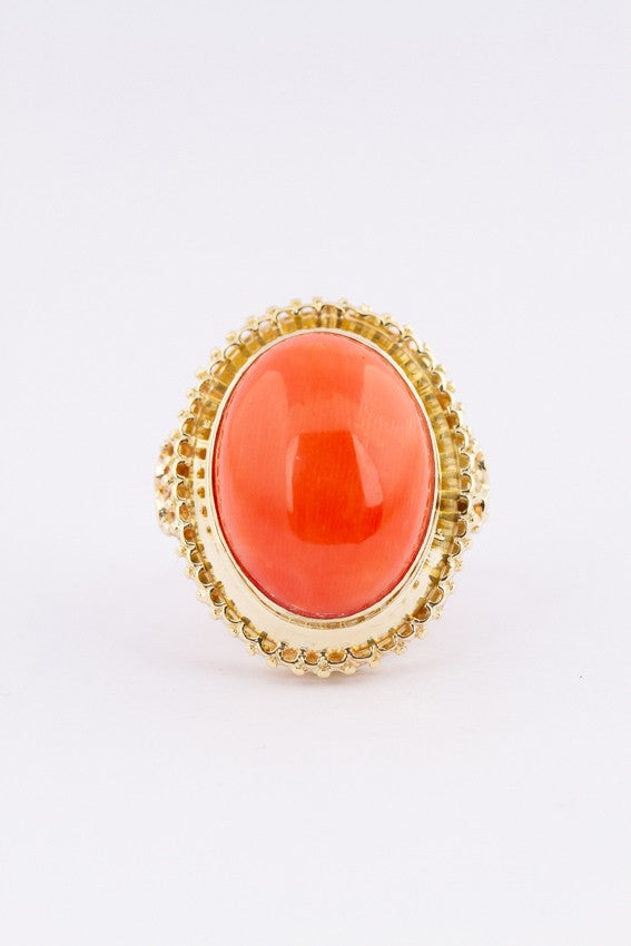 Gold ring with large cabochon cut blood coral