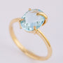 Gold ring with a topaz