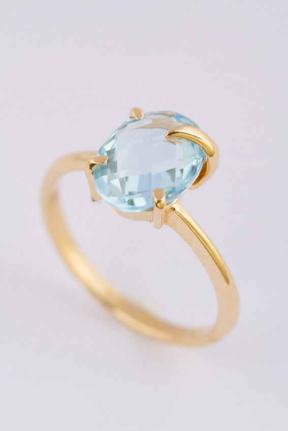 Gold ring with a topaz