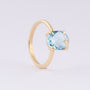 Gold ring with a topaz