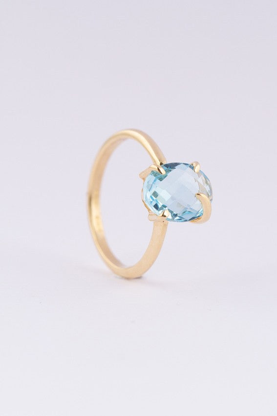Gold ring with a topaz