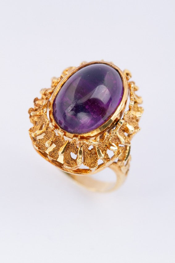 Gold ring with rotating interchangeable amethyst/amazonite stone