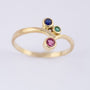 Gouden ring met smaragd, saffier en robijn