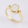 Gold ring with milk opal and diamonds