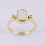 Gold ring with milk opal and diamonds