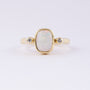 Gold ring with milk opal and diamonds