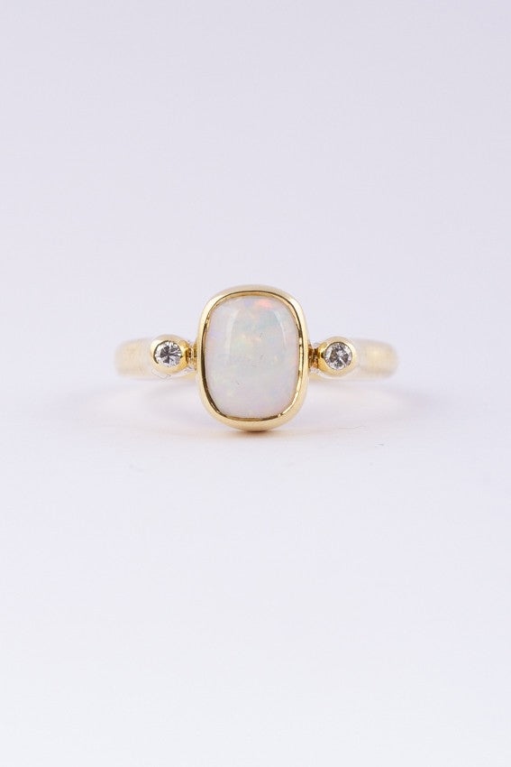 Gold ring with milk opal and diamonds