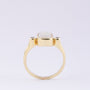 Gold ring with milk opal and diamonds