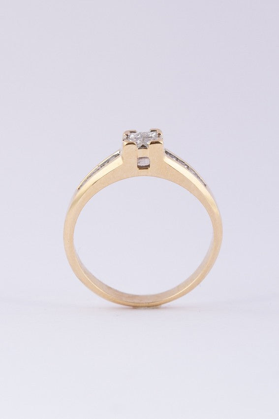 Gold ring with princess cut diamonds