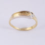 14 carat white/yellow gold ring with a 0.025 ct brilliant