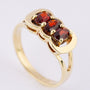 Gold ring with 3 garnets