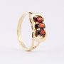 Gold ring with 3 garnets