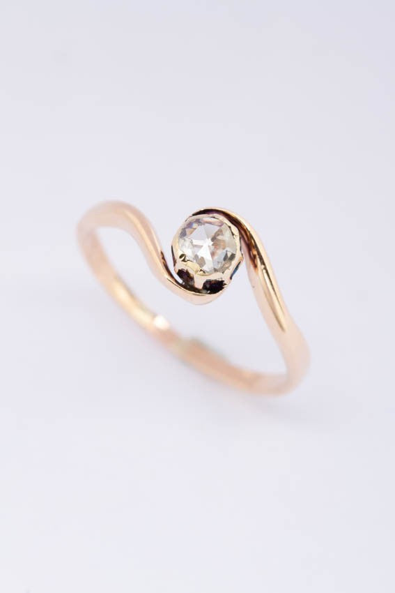 Antique gold ring with a diamond