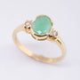 Gold ring with emerald and 2 brilliants.