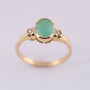 Gold ring with emerald and 2 brilliants.