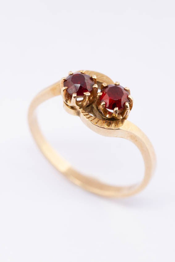 14 carat gold ring with two garnets