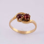14 carat gold ring with two garnets