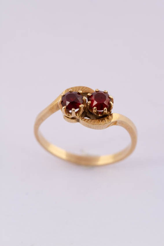 14 carat gold ring with two garnets