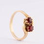 14 carat gold ring with two garnets