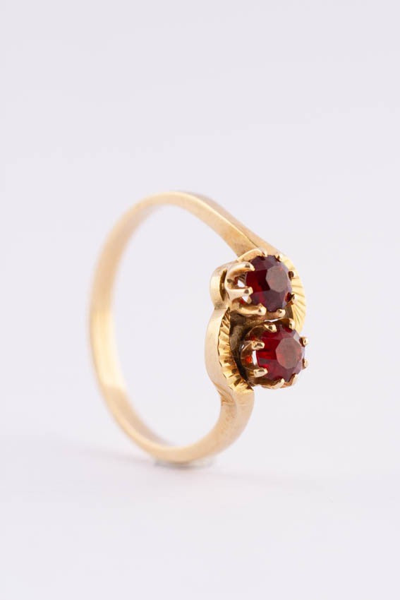 14 carat gold ring with two garnets