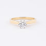 White/yellow gold solitaire ring with a brilliant (0.5 ct.)