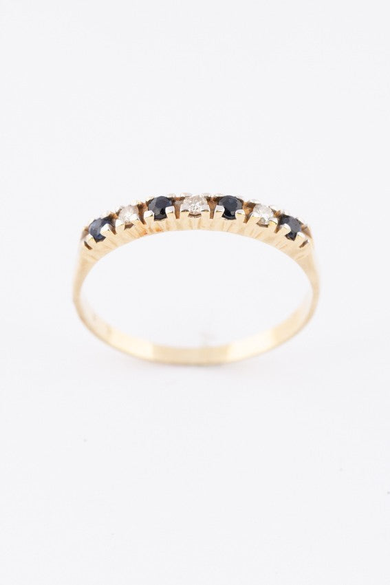 Gold row ring with diamonds and sapphires