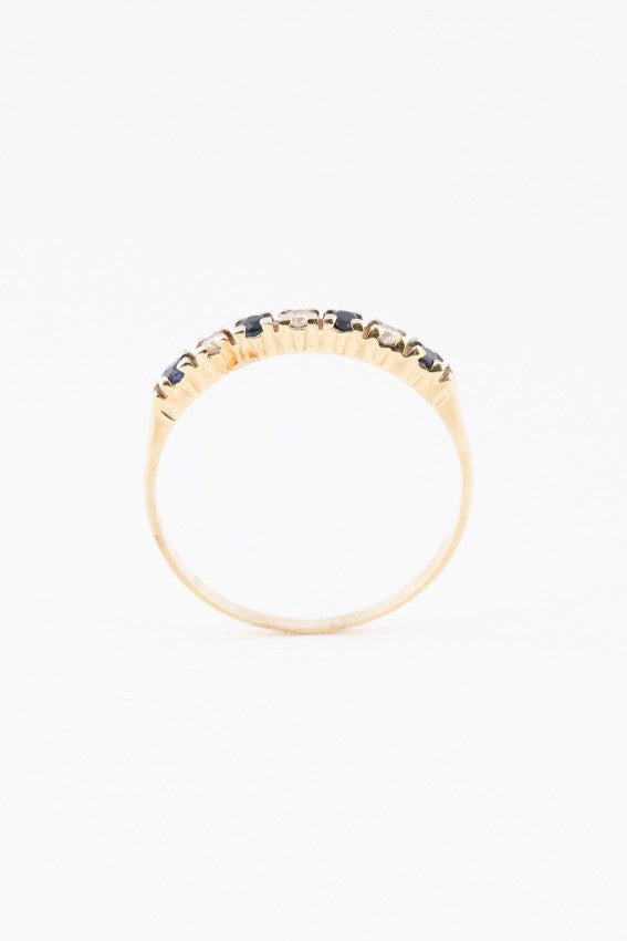 Gold row ring with diamonds and sapphires